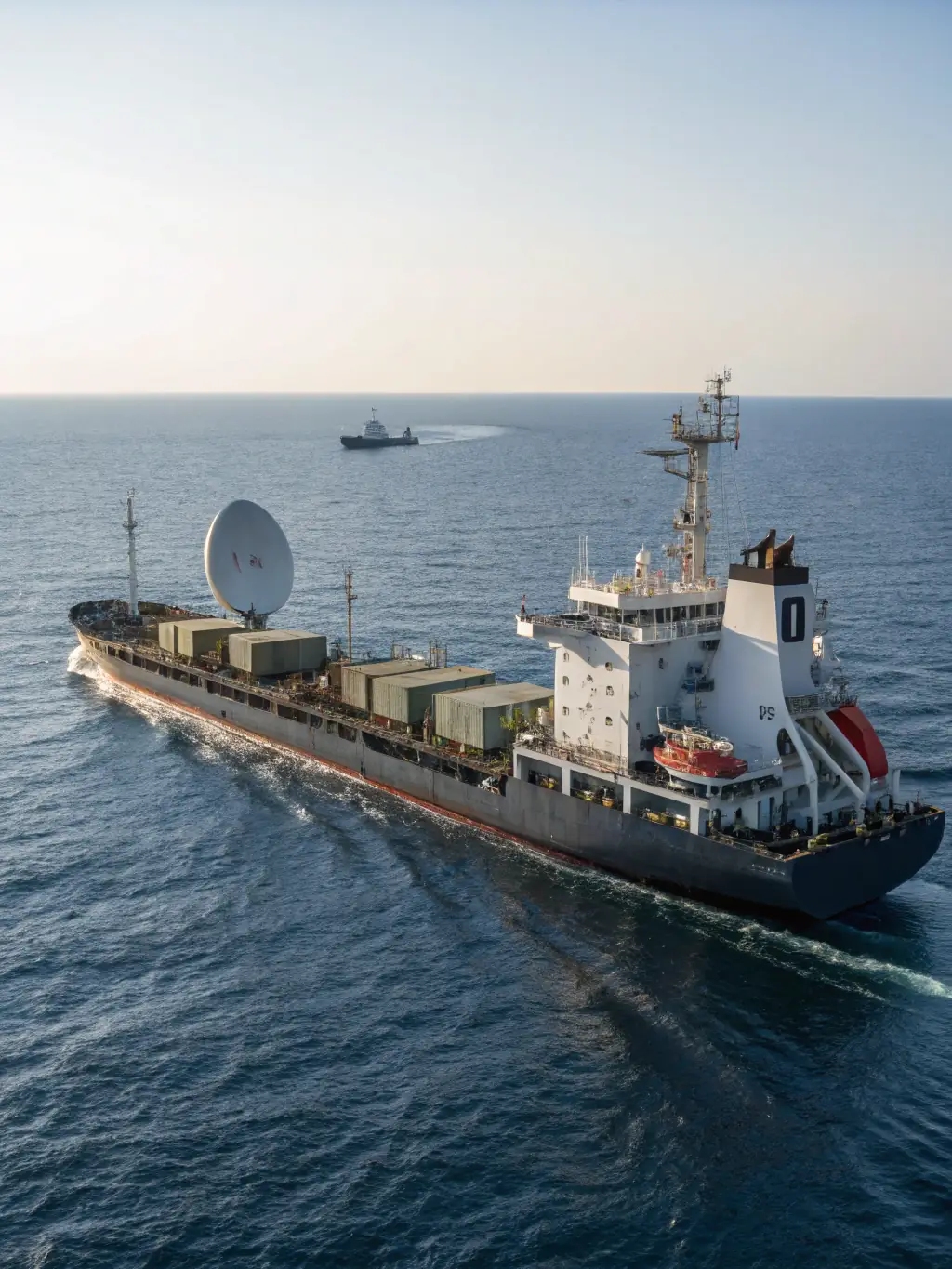 A satellite dish mounted on a ship, transmitting data, symbolizing Vikmar's satellite communication services for maritime operations.